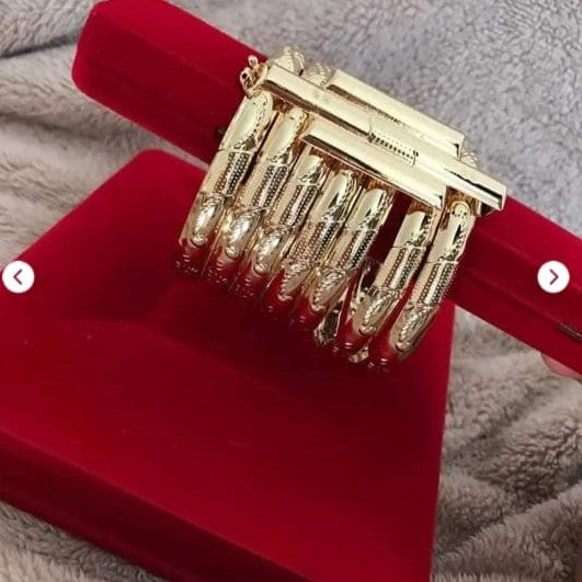 Moroccan Stacked Gold Bangles – Set of 7 with Triple-Strip Clip Accent