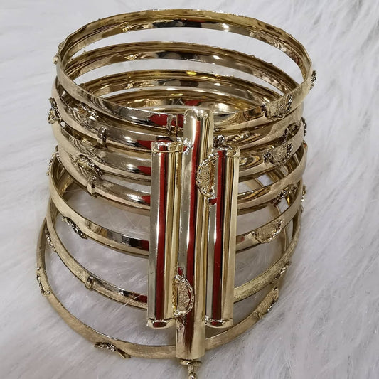 Moroccan Stacked Gold Bangles – Set of 7 with Triple-Strip Clip Accent